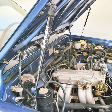 Spiker Engineering hood struts installed in a Toyota 4Runner engine bay