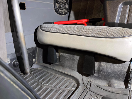 Black rear seat hinge covers installed beneath the rear seat of a 1984-89 Toyota 4Runner